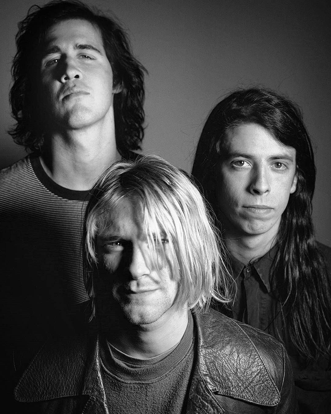 Nirvana band performing live showcasing Kurt Cobain, Dave Grohl and Krist Novoselic during their iconic era
